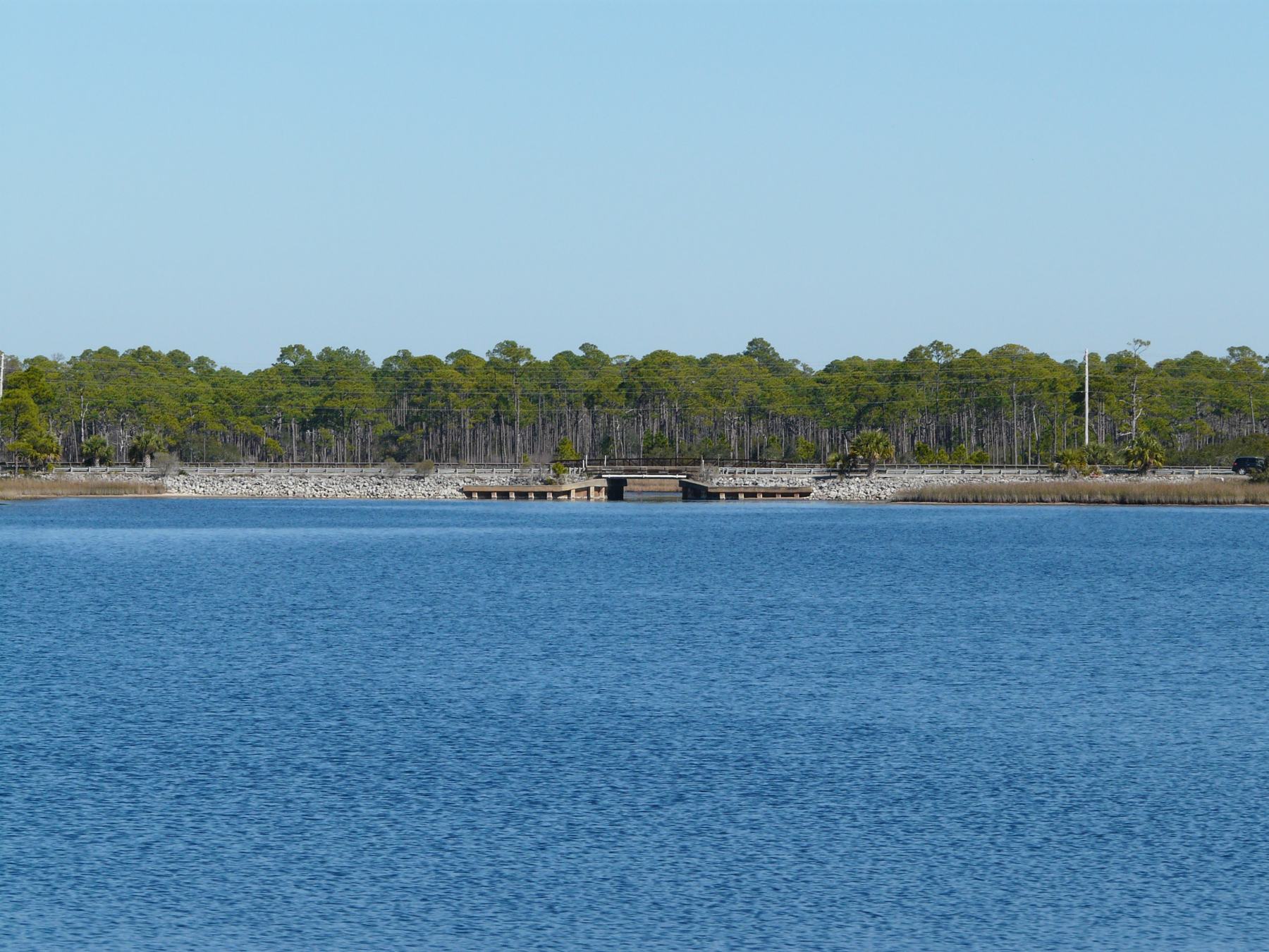County Road 30A crossing Western Lake, with coastal dunes beyond